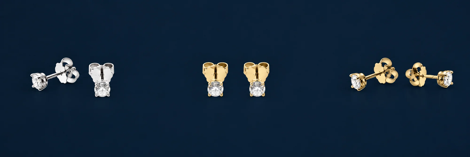 Three pairs of diamond studs in white and yellow gold, seen from the front and the side